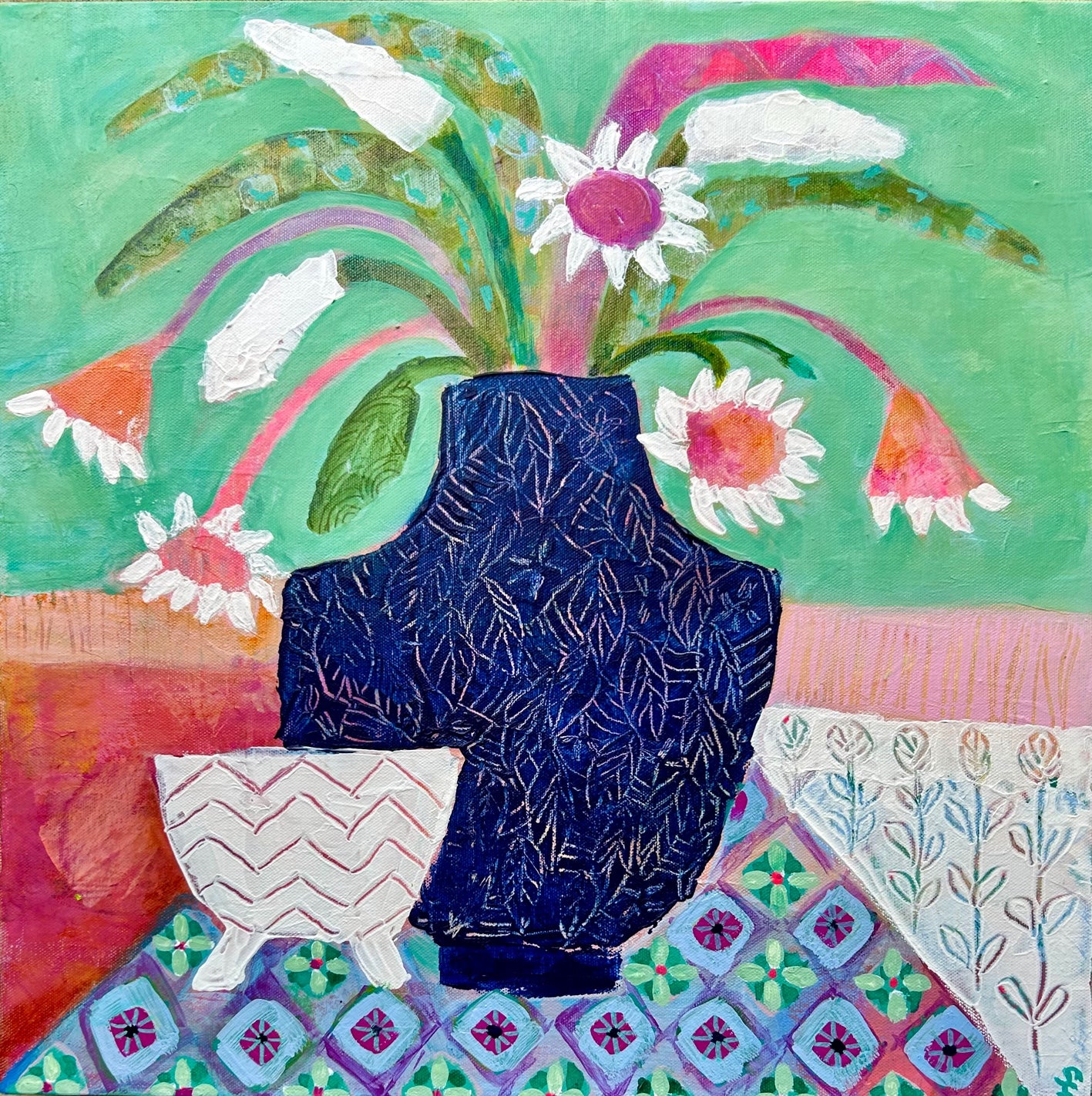 Colourful floral artwork of daisy’s in a blue ginger jar with a white bowl and patterned tablecloth