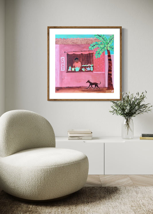Modern interior with a textured chair, white cabinet, and framed artwork on the wall.