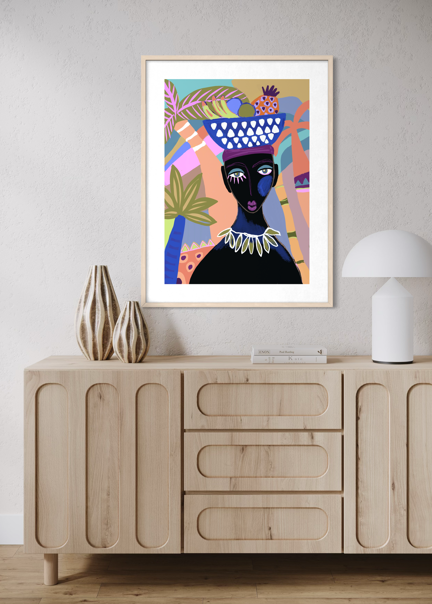 Framed print of colourful African women above sideboard