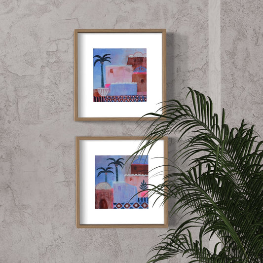 Dusk - set of 2 Moroccan prints in rust, pinks and blues framed in timber on wall with palm tree