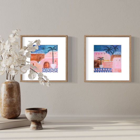 Set of Moroccan prints in inky blue and pinks framed on wall with vase and bowl